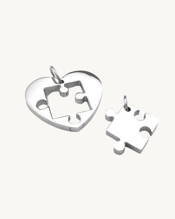 AVELI Two Stainless Steel Interlocking Heart and Puzzle Piece Pendants (Silver Tone) - Special Order